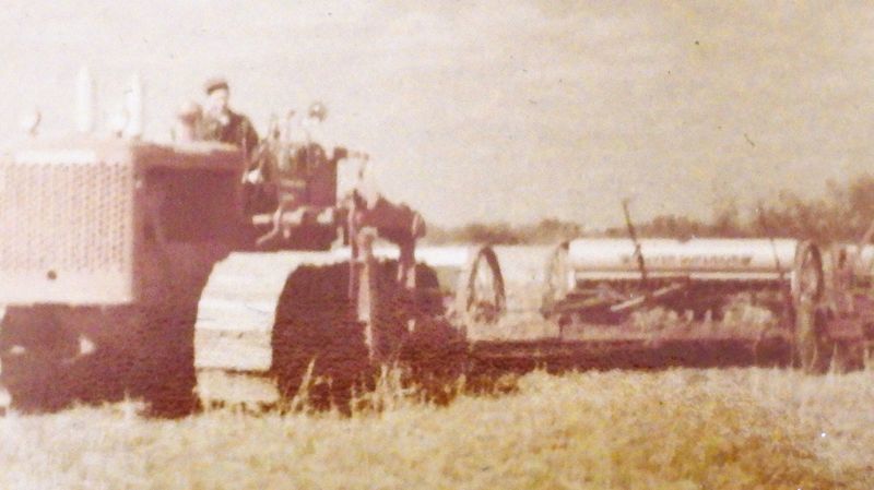 A bulldozer pulls disk plows and grain drills circa 1940s. Not all of the attached equipment is pictured. Columnist Jim Goetze took photographs of old pictures in his family's photo albums to help show how agricultural cultural practices have changed over the years.