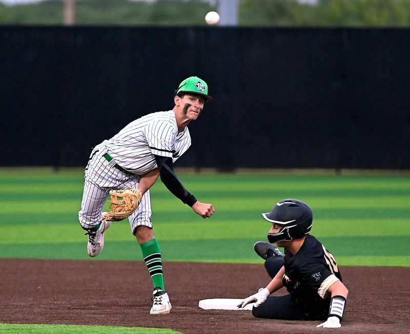 May second baseman Cayson Dail throws to first after tagging out Jayton’s Casey Spray during Game Two of Thursday’s high school baseball series between Jayton and May in Clyde April 29, 2026. Final score in the best-out-of-three series was 17-2 and 18-2, May.