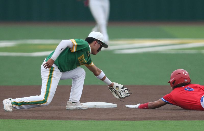 New Deal's Easton Calzada tags out a Sundown runner on a steal attempt in Game 2 of a Class 2A Division I bi-district playoff baseball series Thursday, April 30, 2026, at New Deal High School in New Deal.