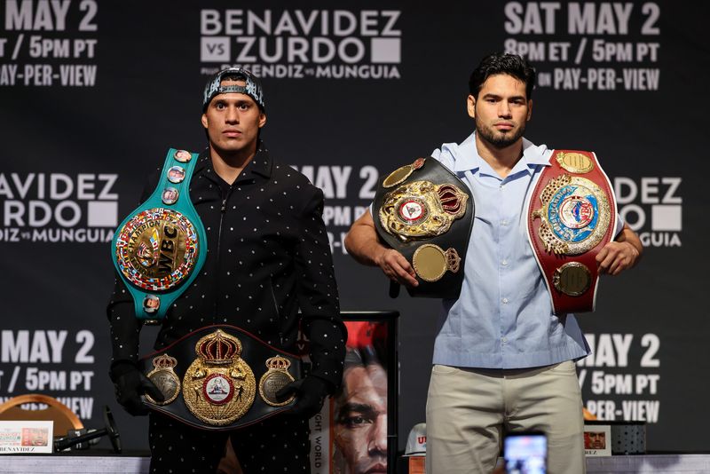 David Benavidez and Gilberto Ramirez pose on stage after the final press conference ahead of their unified cruiserweight title fight on May 2 at T-Mobile Arena in Las Vegas.