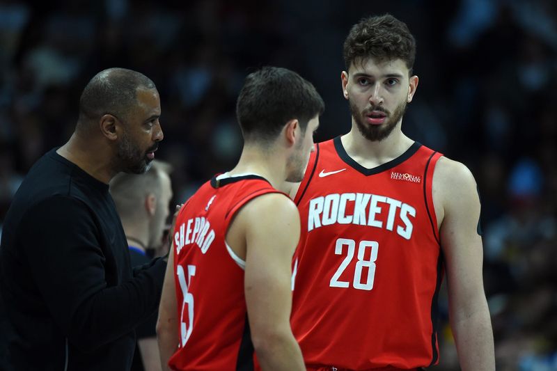 Dec 20, 2025; Denver, Colorado, USA; Houston Rockets center Alperen Sengun (28) and guard Reed Sheppard (15) talk with Houston Rockets head coach Ime Udoka during the second half against the Denver Nuggets at Ball Arena. Mandatory Credit: Christopher Hanewinckel-Imagn Images