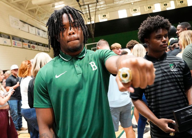 Basha High running back Noah Roberts shows off his ring during the ring ceremony honoring players and coaches who were part of the 2025 Open Division state championship team on April 29, 2026, at Basha High in Chandler.
