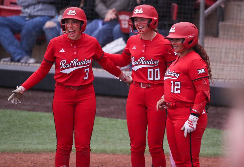 Texas Tech players Makayla Garcia (3), Jackie Lis (00) and Jasmyn Burns greet Mia Williams at home after a home run against Baylor during a Big 12 Conference softball game, Friday, May 1, 2026, at Tracy Sellers Field.