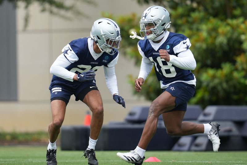May 1, 2026; Frisco, TX, USA; Dallas Cowboys cornerback Devin Moore (29) and Dallas Cowboys safety Caleb Downs (18) go through a drill during practice at the Ford Center at the Star Training Facility in Frisco, Texas. Mandatory Credit: Chris Jones-Imagn Images