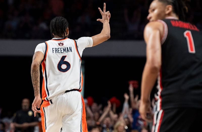 Auburn Tigers guard Elyjah Freeman (6) celebrates his three-pointer as Auburn Tigers take on the Houston Cougars at Legacy Arena in Birmingham, Ala. on Sunday, Nov. 16, 2025. Houston Cougars lead Auburn Tigers 39-35 at halftime.