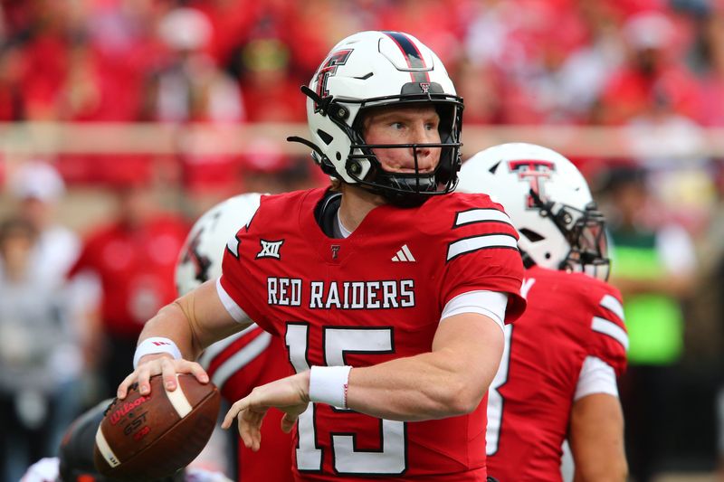 Oct 25, 2025; Lubbock, Texas, USA; Texas Tech Red Raiders quarterback Will Hammond (15) passes against the Oklahoma State Cowboys in the first half at Jones AT&T Stadium. Mandatory Credit: Michael C. Johnson-Imagn Images