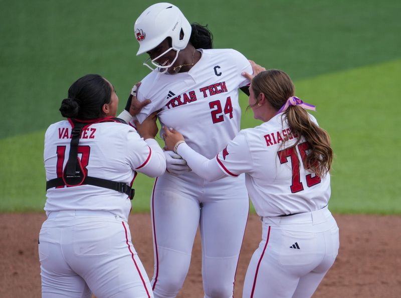 NiJaree Canady celebrates completing a perfect game with teammates Victoria Valdez and Chloe Riasetto in Texas Tech's 8-0 win over Baylor in Big 12 Conference softball game, Saturday, May 2, 226, at Tracy Sellers Field.