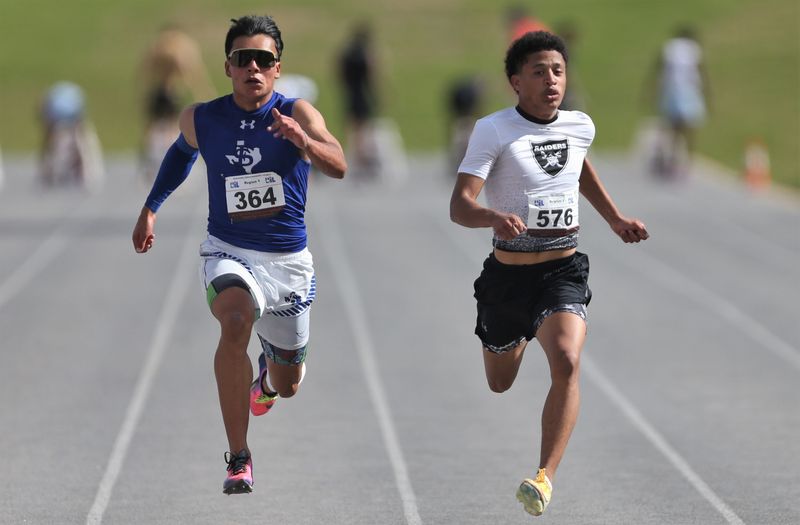 Canyon Randall's Phoenix Sherwood, right, and Fort Stockton's Eduardo Hernandez compete in the 100 meters at the Region I-4A track and field meet Saturday, May 2, 2026, at Lowrey Field.