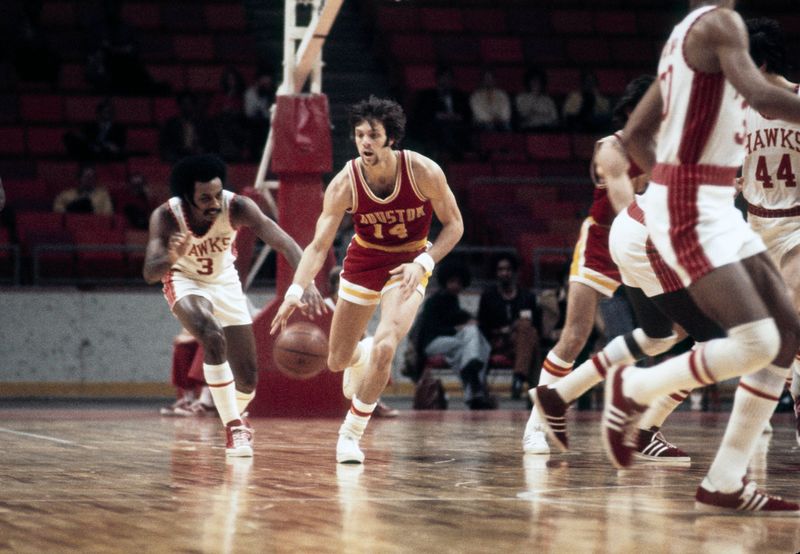 Jan. 9, 1973; Atlanta, GA, USA; FILE PHOTO; Houston Rockets guard Mike Newlin (14) is defended by Atlanta Hawks guard Herm Gilliam (3) during the 1972-73 season at The Omni. Mandatory Credit: Manny Rubio-USA TODAY Sports