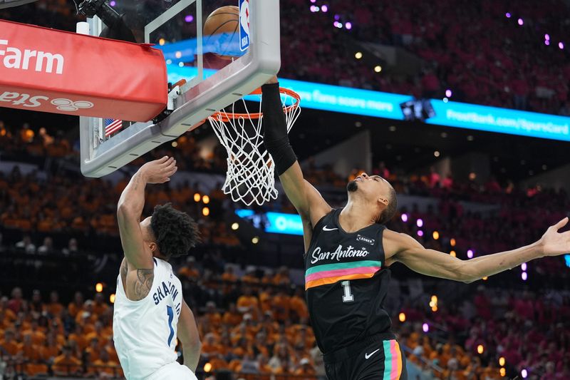 May 4, 2026; San Antonio, Texas, USA; San Antonio Spurs forward Victor Wembanyama (1) blocks a shot by Minnesota Timberwolves guard Terrence Shannon Jr. (1) in the first half during game one of the second round of the 2026 NBA Playoffs at Frost Bank Center. Mandatory Credit: Daniel Dunn-Imagn Images