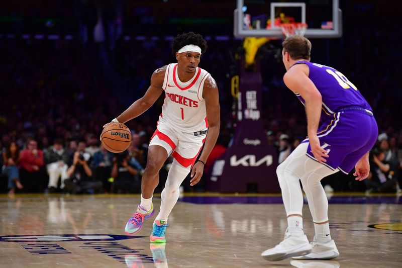 Apr 29, 2026; Los Angeles, California, USA; Houston Rockets guard Amen Thompson (1) moves the ball against Los Angeles Lakers guard Luke Kennard (10) during the second half in game five of the first round of the 2026 NBA Playoffs at Crypto.com Arena. Mandatory Credit: Gary A. Vasquez-Imagn Images
