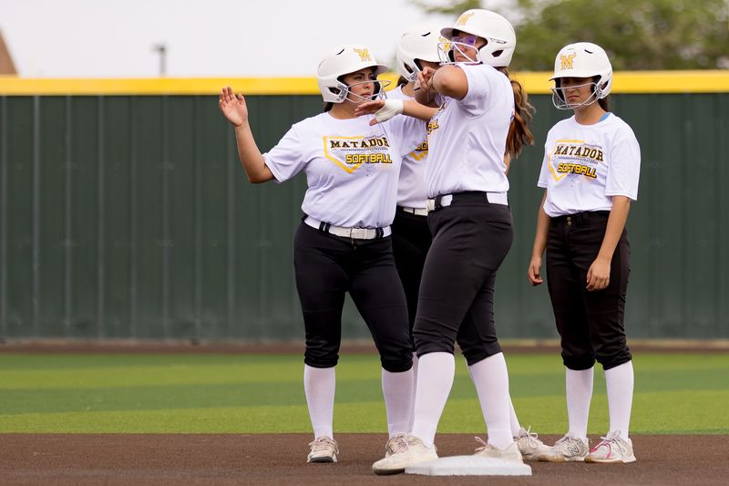 Parkland softball players dance during practice at Parkland High School in El Paso, Texas, on May 5, 2026, ahead of the Class 5A Division II regional semifinals.