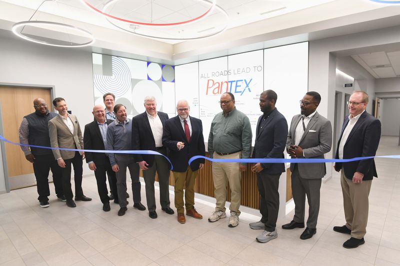 Pantex High Explosives Sciences and Engineering Facility officially opened Wednesday May 6. Cutting the ribbon are from left, Jamel Gray, Steve Cline, Jason Armstrong, Scott Kennedy, Tyler Wean, Kelly Beierschmitt, Monty Cates, Richard Person, Jahleel Hudson, Marcus Lea and Carl Beard.