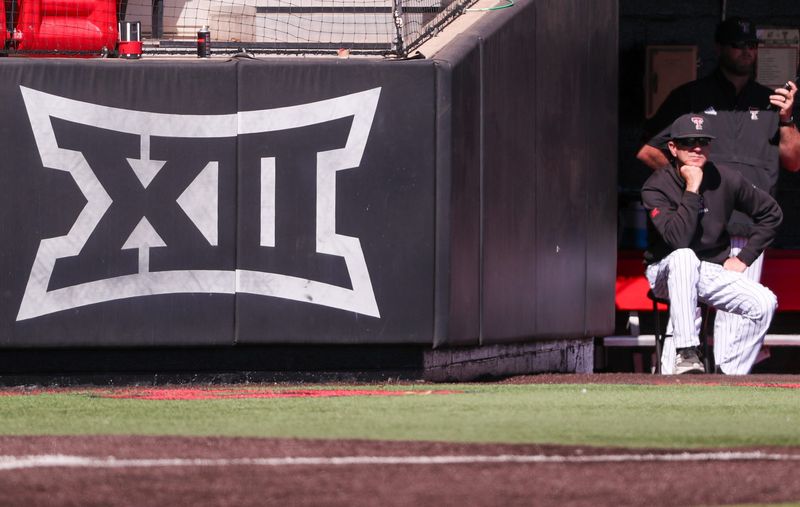 Texas Tech head coach Tim Tadlock sits next to the Big 12 Conference logo during a non-conference Division I baseball game, Wednesday, March 5, 2025, at Dan Law Field.