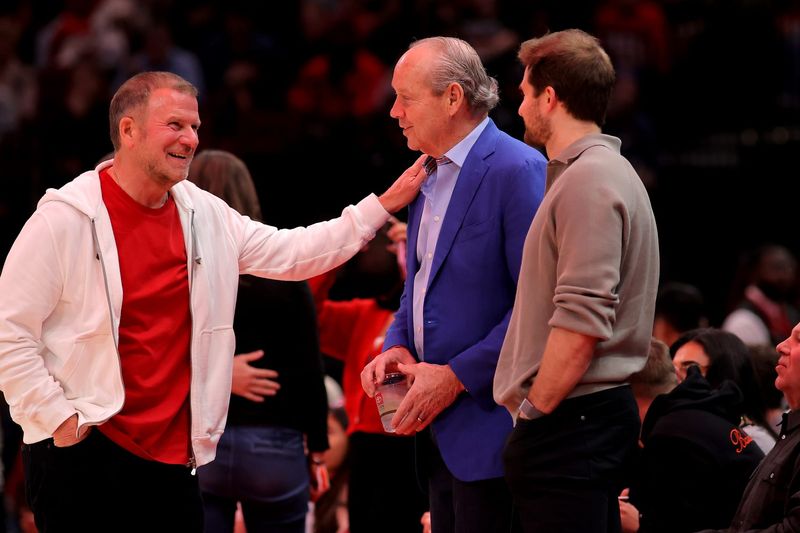Feb 1, 2025; Houston, Texas, USA; Houston Rockets owner Tillman Fertitta (white) talks with Houston Astros owner Jim Crane (blue) during a timeout against the Brooklyn Nets during the third quarter at Toyota Center. Mandatory Credit: Erik Williams-Imagn Images