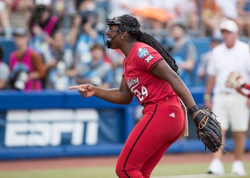 Jun 6, 2025; Oklahoma City, OK, USA; Texas Tech Red Raiders pitcher NiJaree Canady (24) points to her catcher after a strikeout in the first inning against the Texas Longhorns during game three of the NCAA Softball Women's College World Series finals at Devon Park. Mandatory Credit: Brett Rojo-Imagn Images