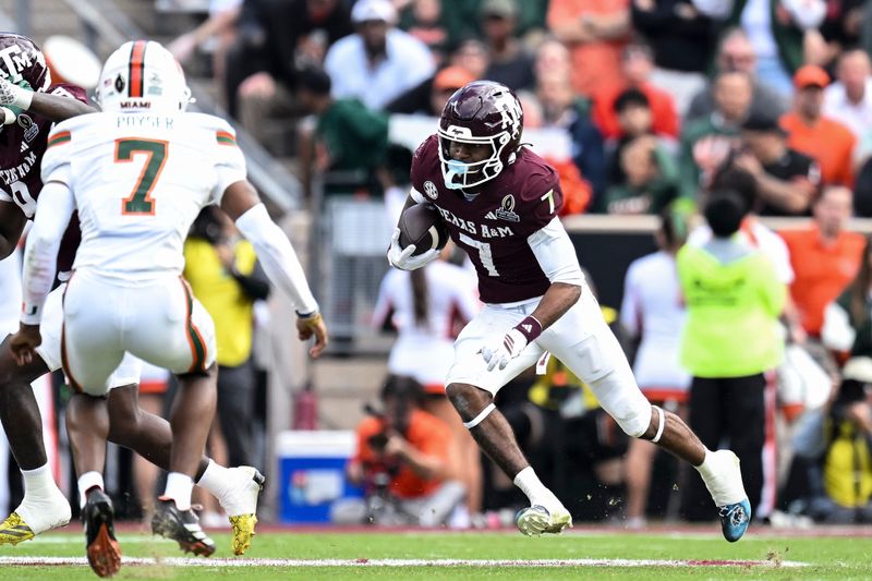 Dec 20, 2025; College Station, TX, USA; Texas A&M Aggies wide receiver KC Concepcion (7) runs the ball against the Miami Hurricanes during the second half at Kyle Field. Mandatory Credit: Maria Lysaker-Imagn Images