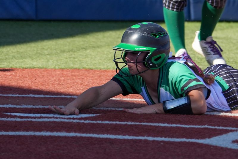 Floydada's Rilynn Hinsley slides in for a run against Colorado City during a Region I-2A Division I regional semifinal softball game, Thursday, May 7, 2026, at Frenship High School in Wolfforth.