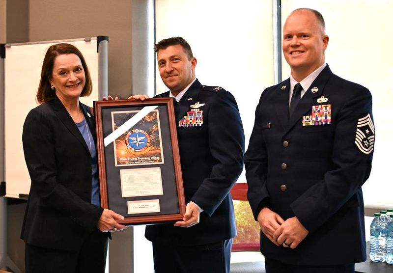 U.S. Air Force Col. Jeffrey Shulman, 80th Flying Training Wing commander, and Stacia Haynie, Midwestern State University president, pose for a photo at MSU Texas in Wichita Falls Tuesday, May 5. Shulman inducted Haynie into the Euro-NATO Joint Jet Pilot Training Hall of Fame in recognition of her leadership and commitment to strengthening the partnership between the university, Sheppard Air Force Base and the ENJJPT program.