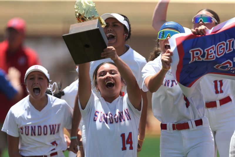 Sundown's Nayleen Morin lifts the team's trophy after a win over Haskell in Game 2 of a Region I-2A Division II semifinal playoff softball series Saturday, May 9, 2026, at the Ira ISD Sports Complex in Ira.