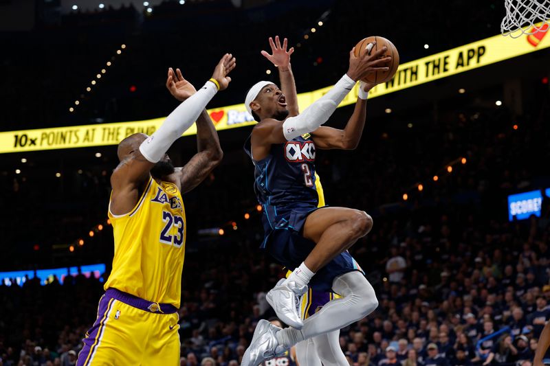 Oklahoma City Thunder guard Shai Gilgeous-Alexander (2) goes up for a basket in front of Los Angeles Lakers forward LeBron James (23) in the second half of Game 2.