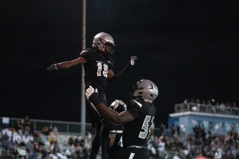 St. Peter Prep's Amari Jones (10) celebrates with his teammate Olubobola Oluwasemilore (52) during a high school football game between St. Peterâ€™s Prep and Paramus Catholic in Jersey City on Friday, Aug. 29, 2025.