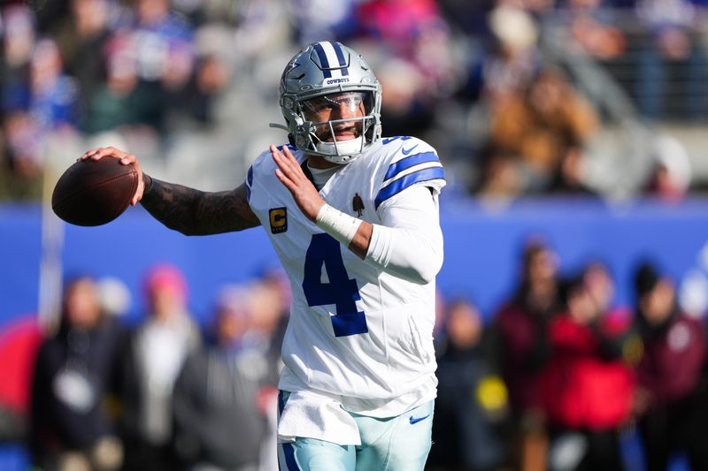 Jan 4, 2026; East Rutherford, New Jersey, USA; Dallas Cowboys quarterback Dak Prescott (4) looks to pass during the first quarter against the New York Giants at MetLife Stadium.
