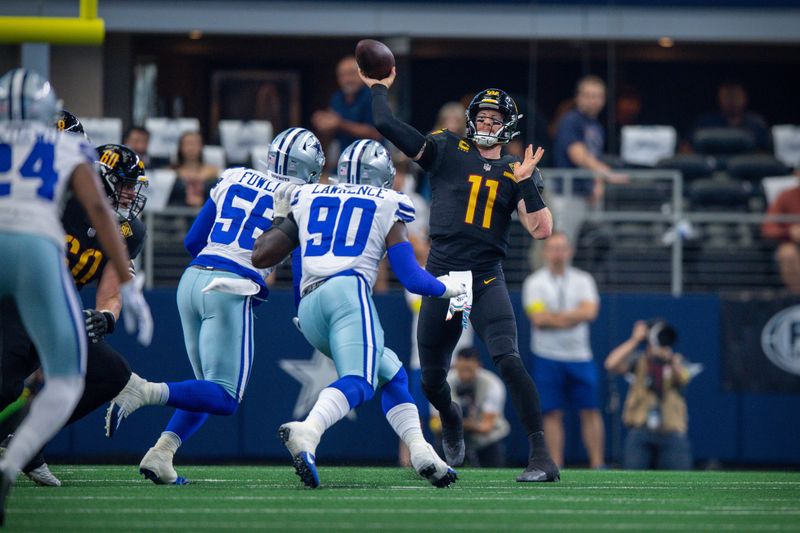Oct 2, 2022; Arlington, Texas, USA; Washington Commanders quarterback Carson Wentz (11) passes over the rush of Dallas Cowboys defensive end Dante Fowler Jr. (56) and defensive end DeMarcus Lawrence (90) at AT&T Stadium. Mandatory Credit: Jerome Miron-USA TODAY Sports