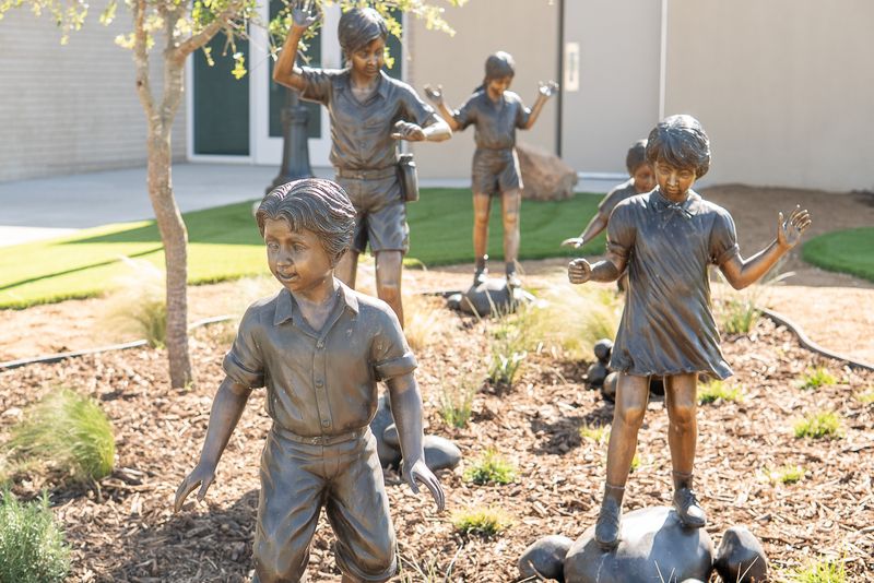Five of the six bronze student statues donated by Abilene ISD on display at Abilene Heritage Square on May 12. Abilene ISD approved the donation of the six statues at the May 11 AISD school board meeting.