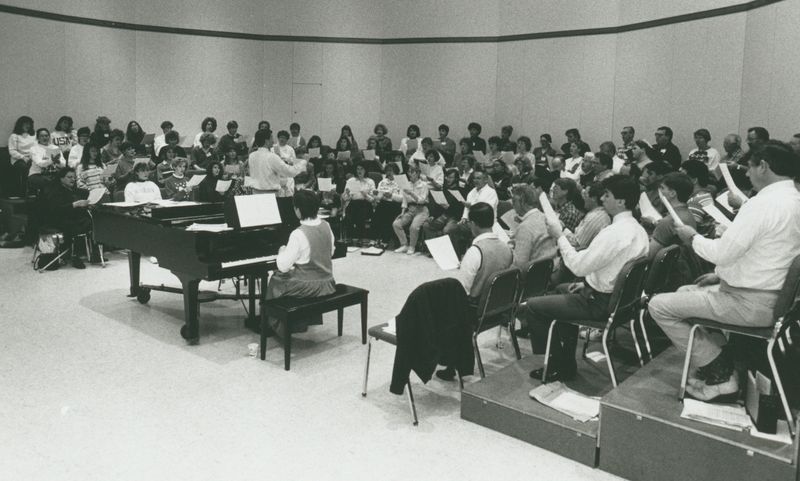 The University-Civic Chorale rehearses for its Family Christmas Concert in December 1991.