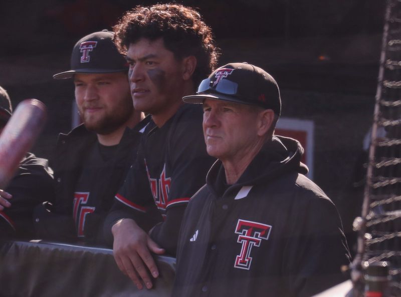 Head coach Tim Tadlock (bottom) and Linkin Garcia look on during the Texas Tech baseball team's alumni game, Saturday, Jan. 31, 2026, at Rip Griffin Park.