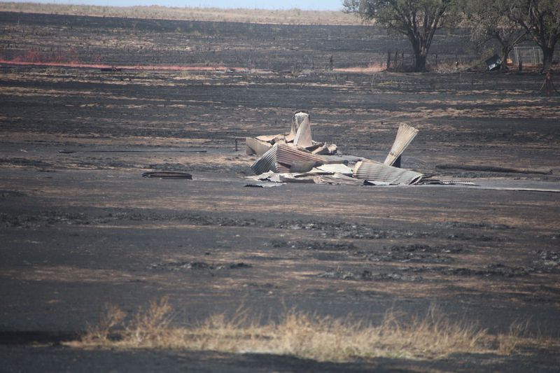 Debris and charred ground is visible from the Hunggate Fire in Randall County on Friday, May 15. The wildfire burned an estimated 14,000 acres and was only 40% contained, and it jumped several roads, including Highway 87 and Western on Friday.