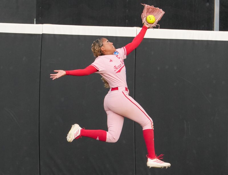 Texas Tech's Mihyia Davis attempts to catch a fly ball against Marist during the Lubbock Regional of the NCAA Division I softball tournament, Friday, May 15, 2026, at Tracy Sellers Field.
