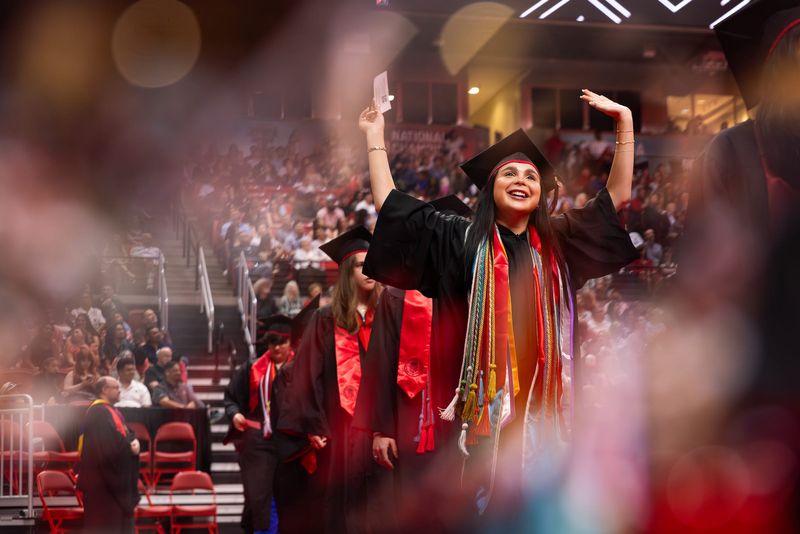 A graduate from Texas Tech University celebrates during the May 15, 2026 Commencement ceremony.