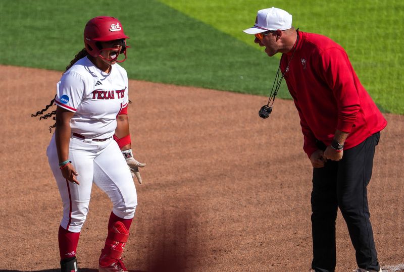 Texas Tech's Jasmyn Burns reacts to her game-tying hit against Ole Miss with assistant coach Hunter Veach during the Lubbock Regional of the NCAA Division I softball tournament, Saturday, May 16, 2026, at Tracy Sellers Field.