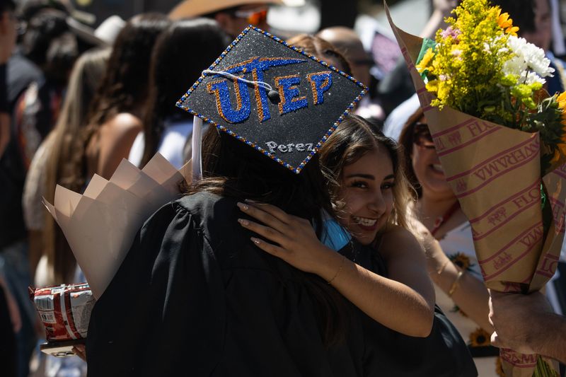 Graduates of the University of Texas at El Paso greet family and friends following the 2026 spring graduation ceremony at the Don Haskins Center in El Paso, Texas, on May 16, 2026.