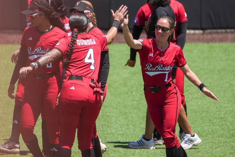 Texas Tech's Logan Halleman and Lagi Quiroga share a high-five before facing Ole Miss during the Lubbock Regional of the NCAA Division I softball tournament, Sunday, May 17, 2026, Tracy Sellers Field.