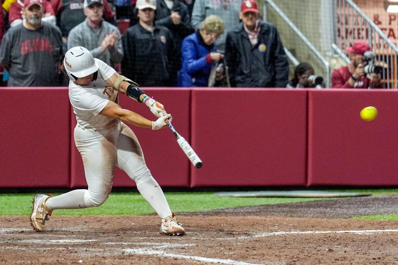 Texas utility Katie Stewart (20) hits gets a base hit during an NCAA softball game between Oklahoma (OU) and Texas at Loveâ€™s Field in Norman. Okla., on Saturday, April 26, 2025.