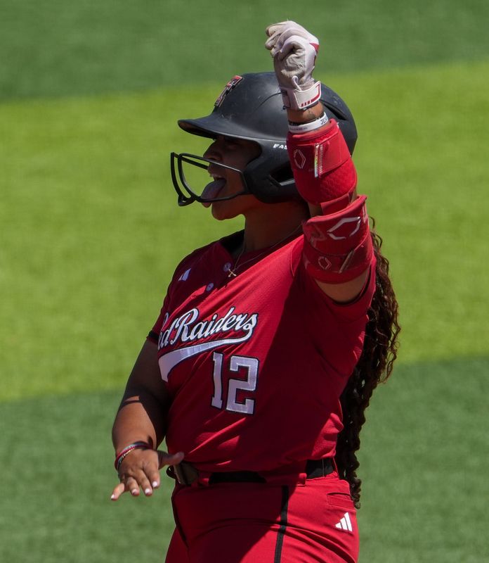 Texas Tech's Jasmyn Burns celebrates a hit against Ole Miss during the Lubbock Regional of the NCAA Division I softball tournament, Sunday, May 17, 2026, at Tracy Sellers Field.