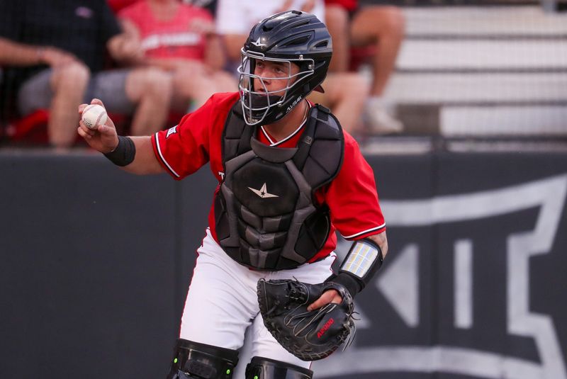 Texas Tech's Matt Quintanar shows the ball after tagging the Abilene Christian runner out at home during a non-conference Division I baseball game, Tuesday, March 31, 2026, at Rip Griffin Park.