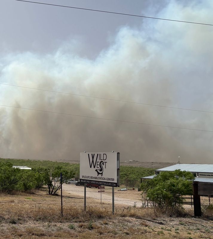 Billowing smoke is seen Monday, May 18 from the Wild West Wildlife Rehabilitation Center, which was evacuating due to the wildfire moving rapidly through the area west of Amarillo.
