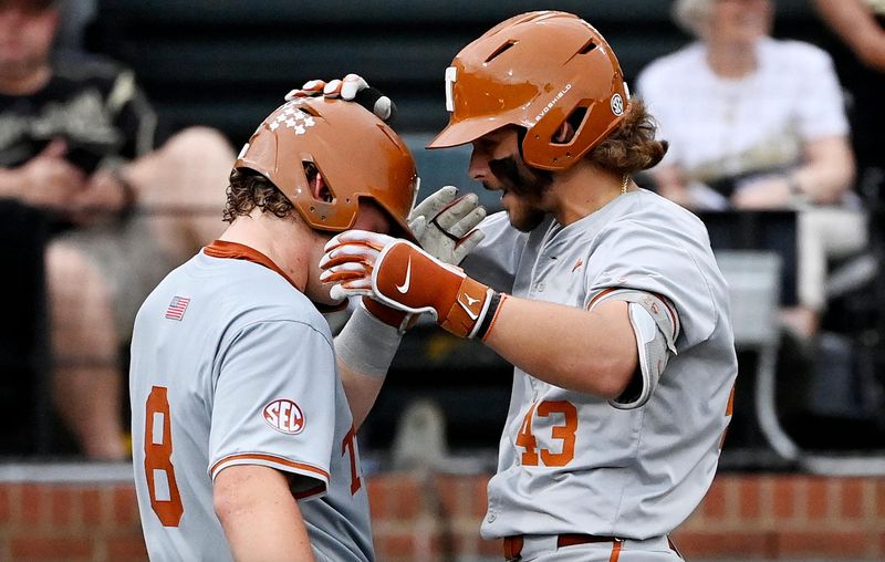 Texas’ Aiden Robbins (43) celebrates with Carson Tinney (8) after hitting a home run during the third inning of a NCAA baseball game against Vanderbilt at Hawkins Field on Friday, April 24, 2026, in Nashville, Tenn.