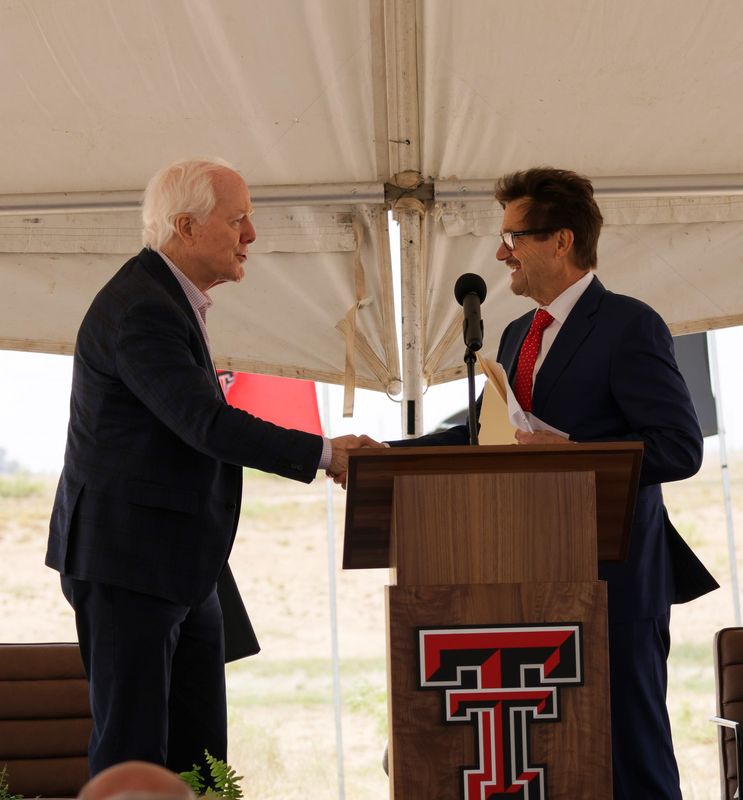 (Left) U.S. Sen. John Cornyn, R-Texas, shakes hands with Texas Tech University President Lawrence Schovanec at the university's groundbreaking ceremony of its Critical Infrastructure Security Site at the Reese National Security Complex on Tuesday, May 19, 2026 in Lubbock, Texas.
