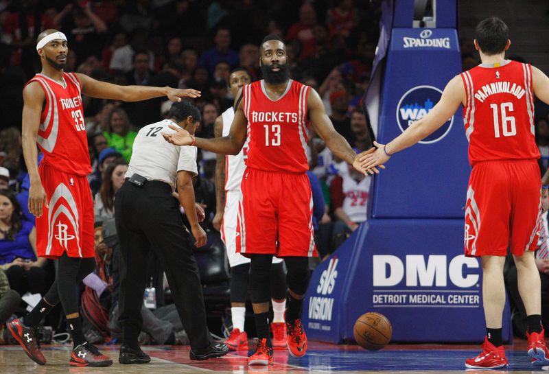 Jan 31, 2015; Auburn Hills, MI, USA; Houston Rockets guard James Harden (13) gets high fives from guard Corey Brewer (33) and forward Kostas Papanikolaou (16) after making a shot and getting fouled during the fourth quarter against the Detroit Pistons at The Palace of Auburn Hills. Pistons beat the Rockets 114-101. Mandatory Credit: Raj Mehta-USA TODAY Sports