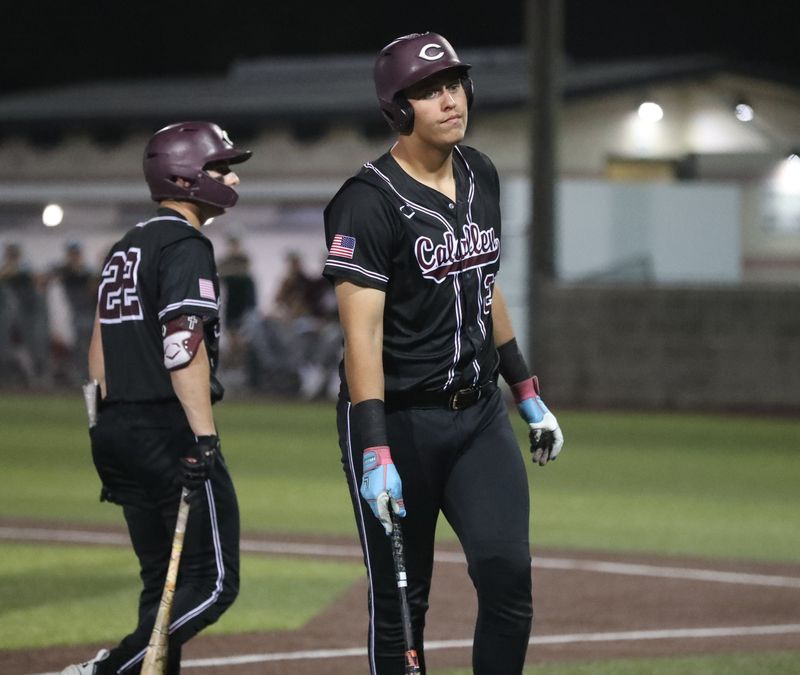 Calallen's Blake Quinn talks to Drayton Mitchell after his at-bat against Davenport in Game 2 of the Class 4A Division I regional final on Friday, May 22, 2026, at Cabaniss Baseball Field in Corpus Christi.