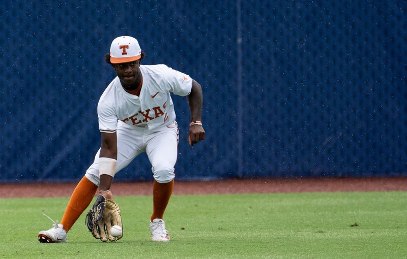 Texas Longhorns' Anthony Pack Jr. (6) scoops a ground ball as Arkansas Razorbacks take on Texas Longhorns during the SEC baseball tournament at Hoover Metropolitan Stadium at Legacy Arena in Hoover, Ala. on Friday, May 22, 2026.