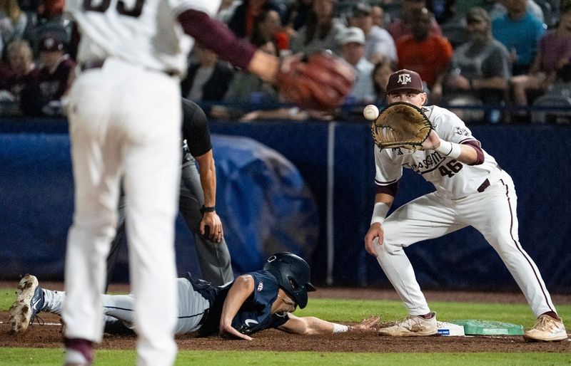 Auburn Tigers' Taylor Belza (25) dives safely back into first base before Texas A&M Aggies' Blake Binderup (46) gets the ball as Auburn Tigers take on Texas A&M Aggies during the SEC baseball tournament at Hoover Metropolitan Stadium at Legacy Arena in Hoover, Ala. on Friday, May 22, 2026.