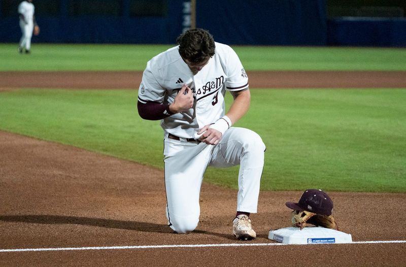 Texas A&M Aggies' Gavin Grahovac (9) prays before Auburn Tigers take on Texas A&M Aggies during the SEC baseball tournament at Hoover Metropolitan Stadium at Legacy Arena in Hoover, Ala. on Friday, May 22, 2026.