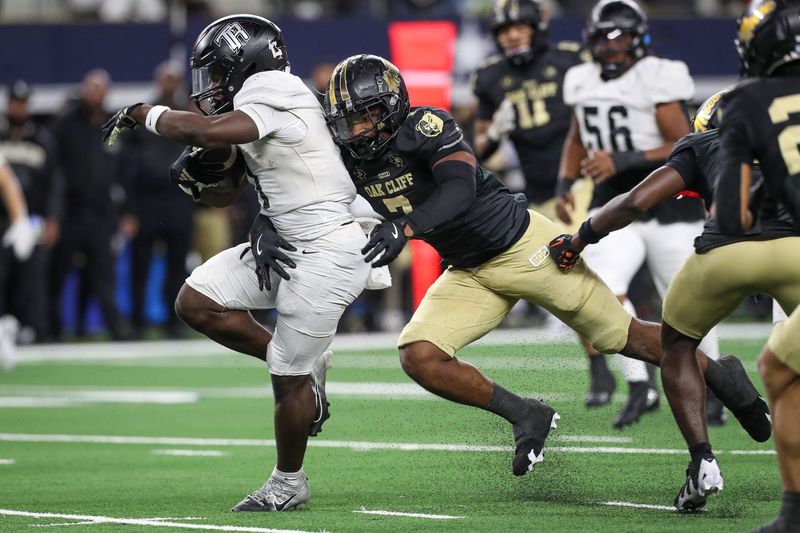 South Oak Cliff's Jamarion Phillips tackles Richmond Randle's Landen Williams-Callis during the Class 5A, Division II State Championship game on Friday, Dec. 20, 2024, at AT&T Stadium in Arlington, Texas.