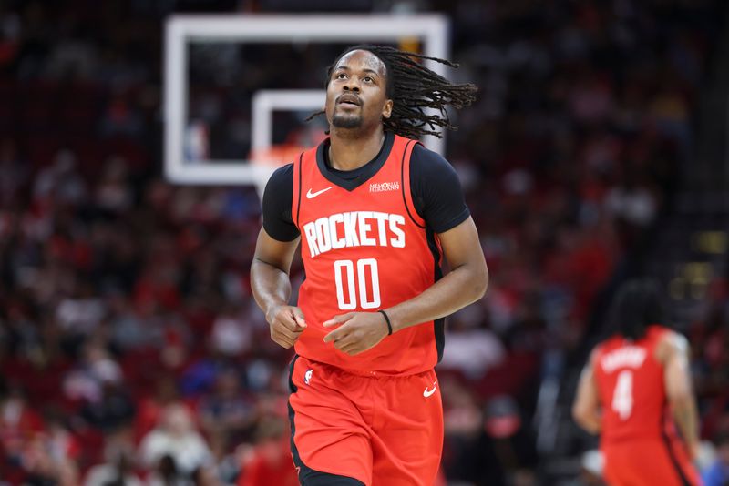 Apr 12, 2026; Houston, Texas, USA; Houston Rockets guard Tristen Newton (00) reacts after a play during the fourth quarter against the Memphis Grizzlies at Toyota Center. Mandatory Credit: Troy Taormina-Imagn Images